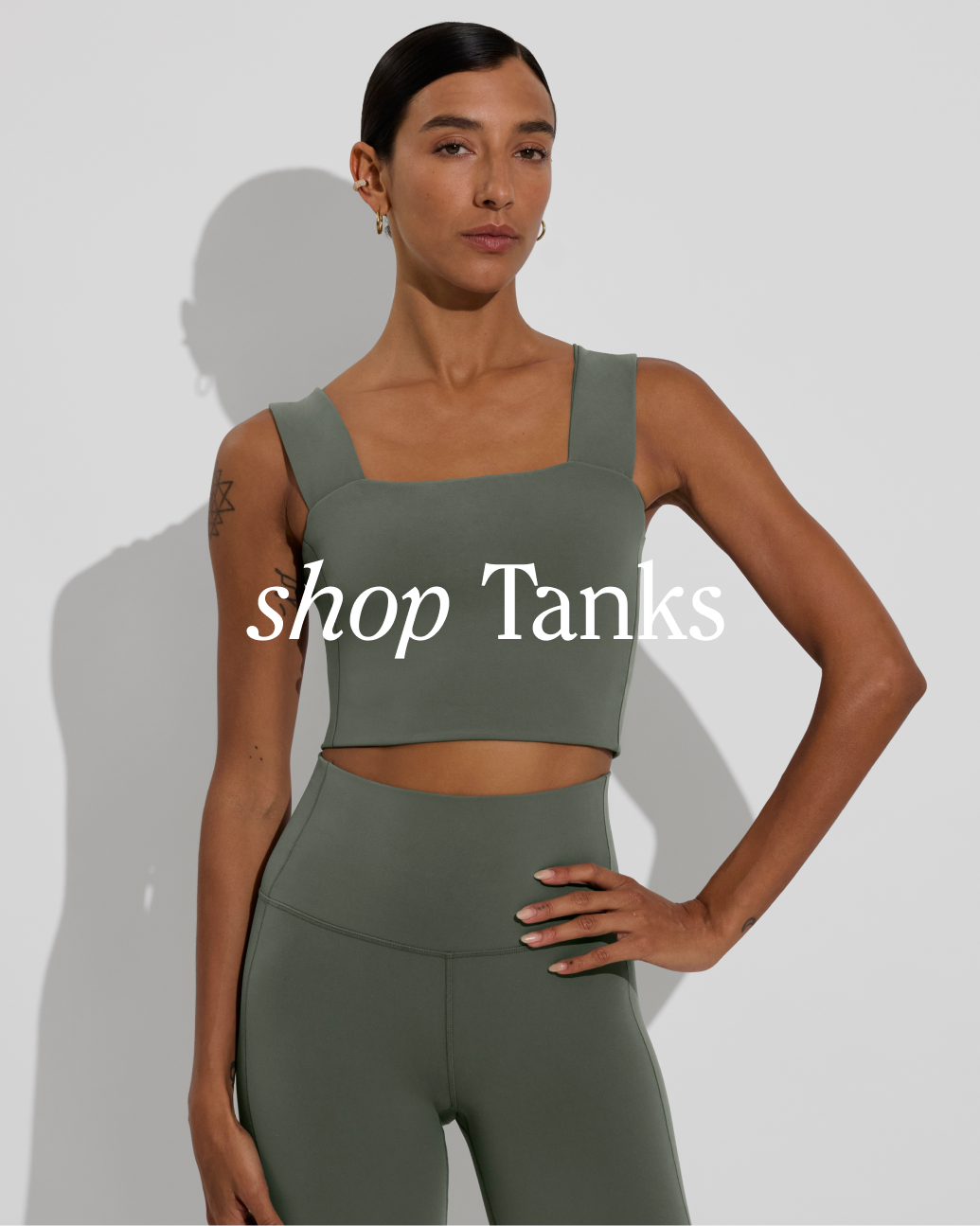 Woman in Frame top paired with super moves tight in agave