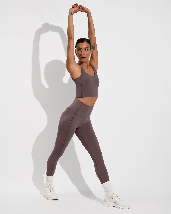 Woman in reset tank paired wtih super moves tight in stormy