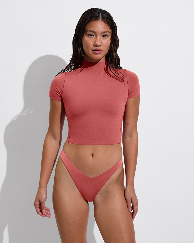 Woman in Rays Short Sleeve Top paired with Backside Thong in Camp