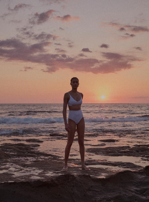 Woman in Costa Rica wearing sunday top and hi tide bottom in coconut