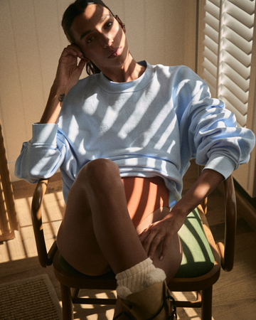 Woman in Swell Long Sleeve Tee in Faded Blue Skies and Hi Hi Bottom in Bronze