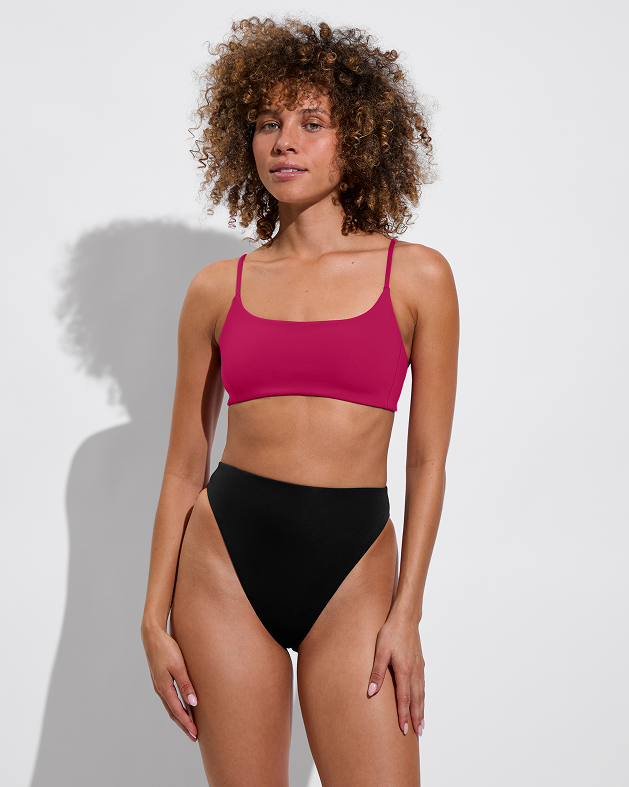 Woman in pool days top in pepper paired with hi hi bottom in jet