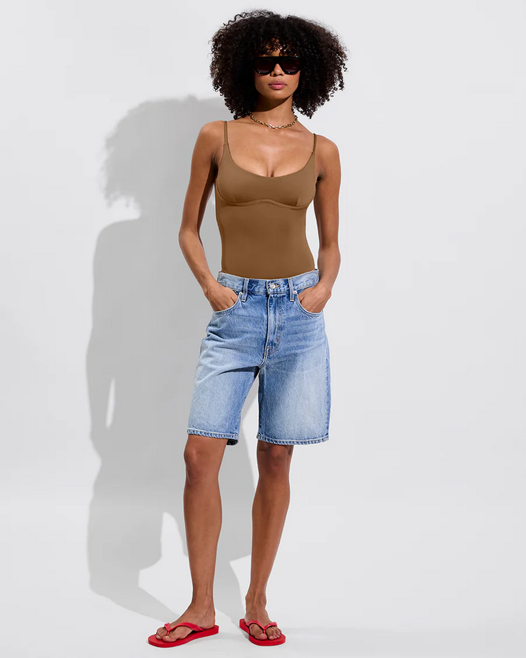 Woman in Club Suit in Tan Lines