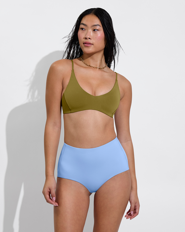 Woman in sunday top in wild paired with barrel bottom in blue skies