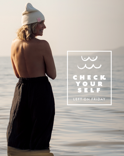 Person standing in water with text 'Check Your Self' on a beach