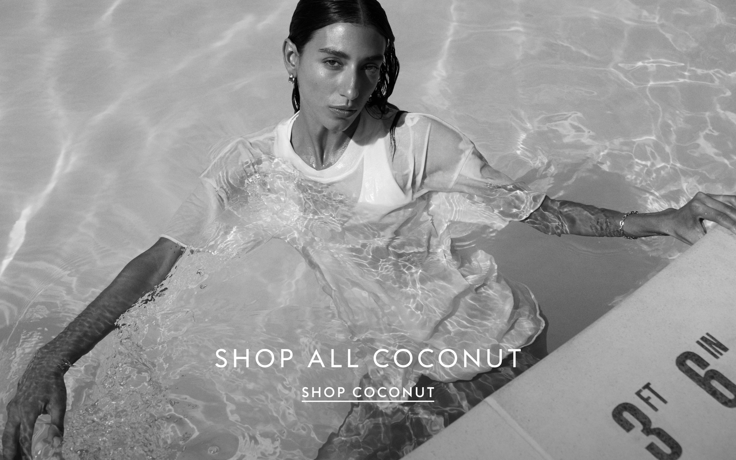 Woman in the pool wearing La crosse top with Swell Oversized Tee in Coconut