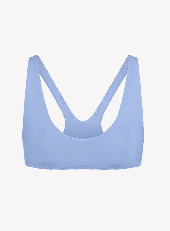 Racerback cut = max mobility. No-dig, super soft straps = zero distractions. Built to move when the rally gets wild.