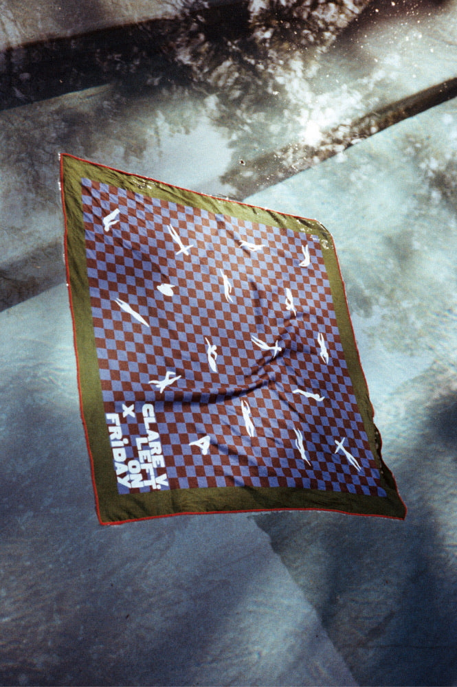 Clare V x Left On Friday bandana floating in a pool