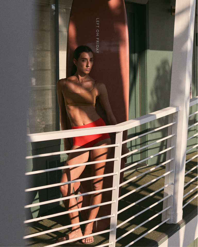 Woman in pool days top in tan lines + barrel bottom in sweet chili heat