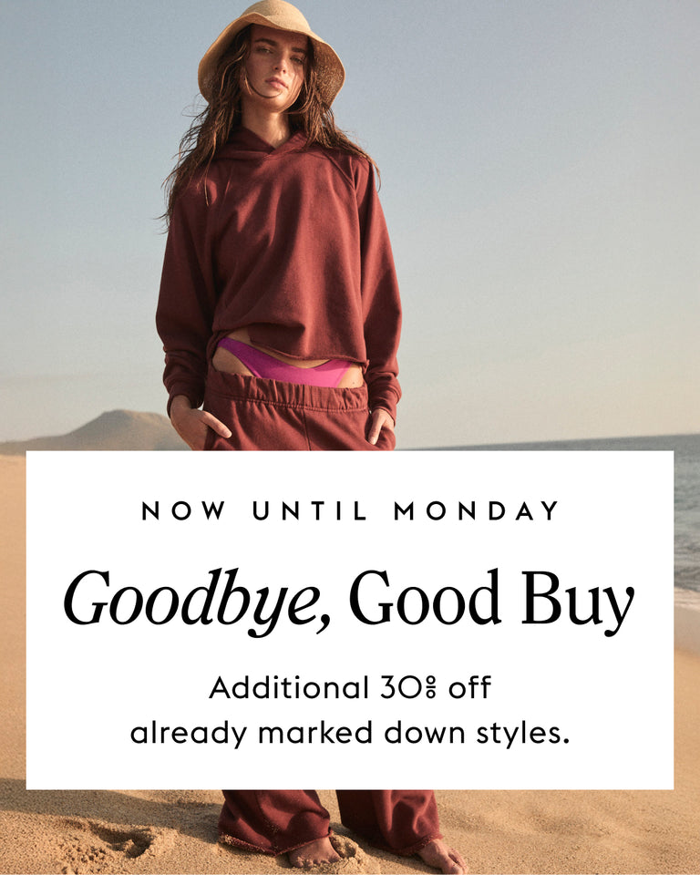 Woman in Homerun Hoodie and Homerun Pant in Jam with text about sale event