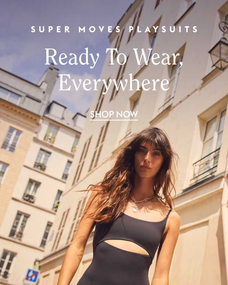 Woman walking on a street in Peak Playsuit in Jet with text overlay about super moves playsuits.
