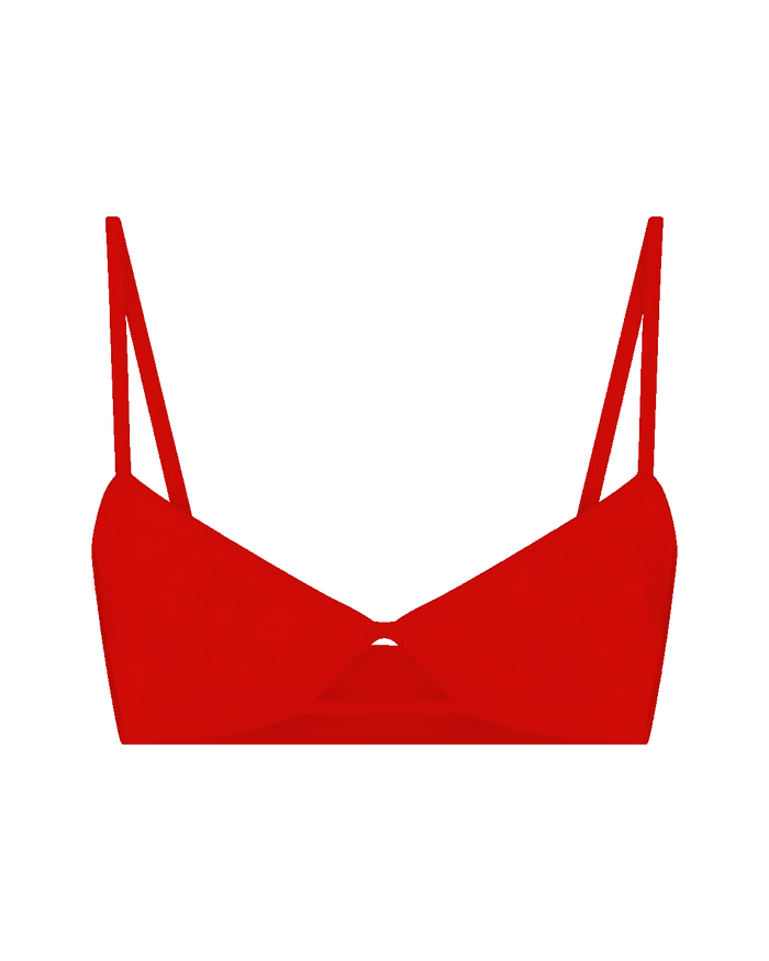 Red bikini top with thin straps on a white background