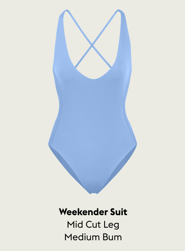 Blue Skies Weekender Suit with criss-cross back design on a light gray background