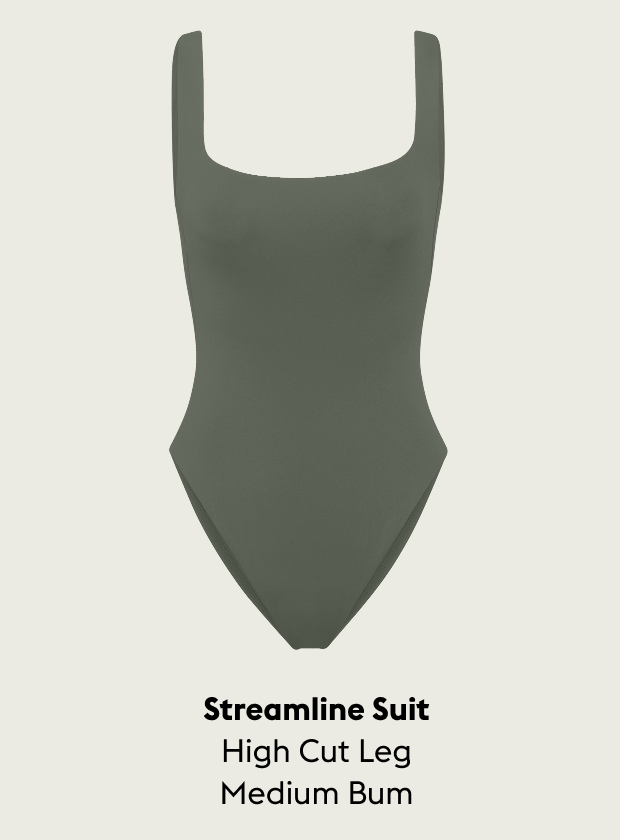 Agave Streamline Suit with high cut leg and medium bum on a light gray background