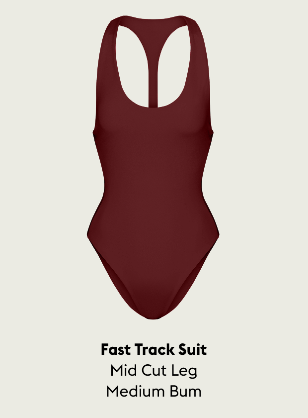 Jam (Maroon) swimsuit with text indicating 'Fast Track Suit, Mid Cut Leg, Medium Bum' on a beige background